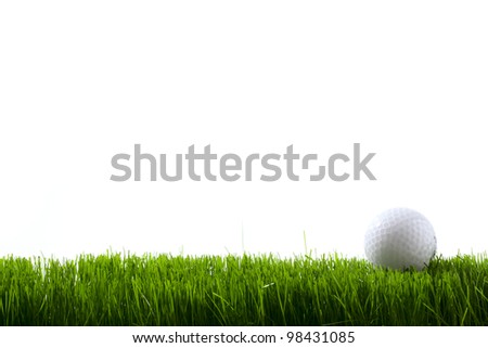 Golf ball on green grass over white