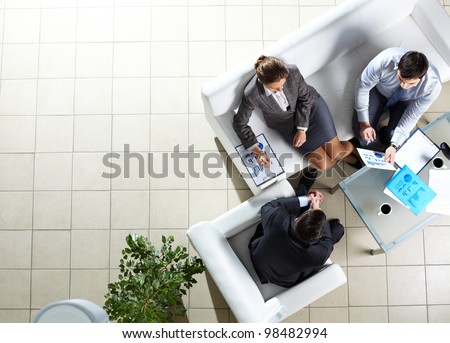 Above angle of three associates interacting at meeting