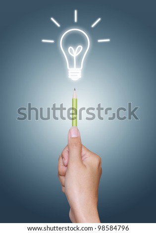 light bulb on pencil in hand, blue background