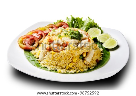 seafood fried rice with tomato and lemon