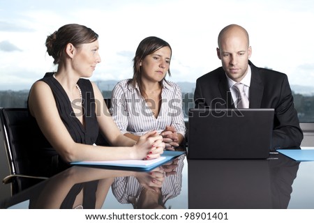 Group of office workers in a powerpoint presentation on laptop