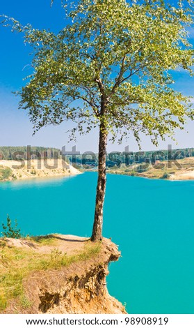 Landscape with lonely tree over blue lake on sky background, Blue Lake, Russia, East Europe