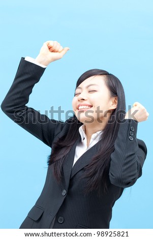 young happy woman isolated on blue background.