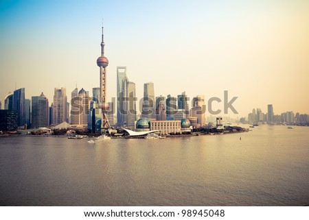 shanghai pudong skyline and huangpu river at dusk