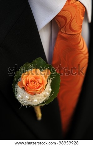 Groom with Tuxedo and Wedding Flower