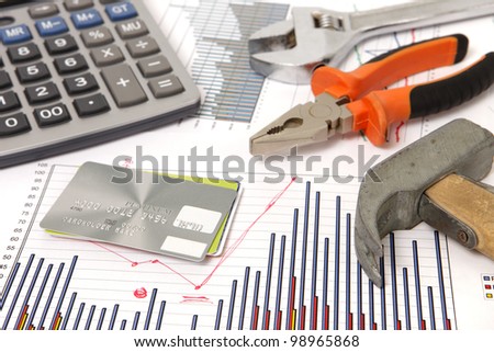 a photo of housebuilding graphics and hammer and credit cards