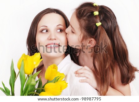 Portrait of Daughter kissing her mother
