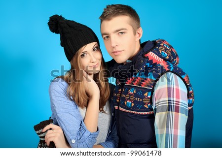 Portrait of a happy young couple in warm clothes.