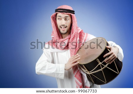 Arab playing drum in studio shooting