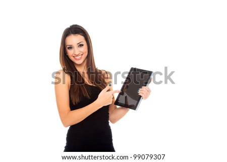 Happy brunette woman holding in hand a tablet touch pad computer and smiling on a white background