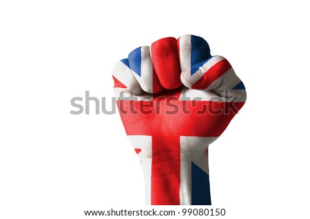Low key picture of a fist painted in colors of united kingdom flag