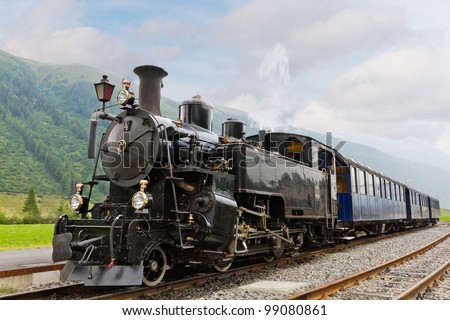 vintage black steam powered railway train Royalty-Free Stock Photo #99080861