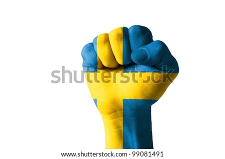 Low key picture of a fist painted in colors of sweden flag