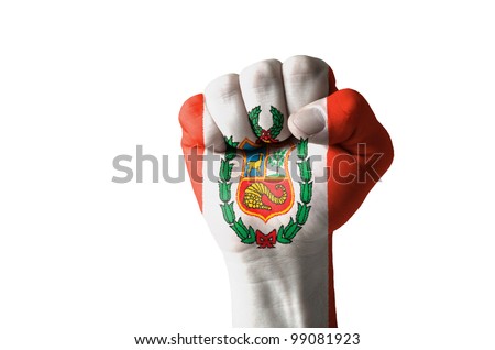 Low key picture of a fist painted in colors of peru flag