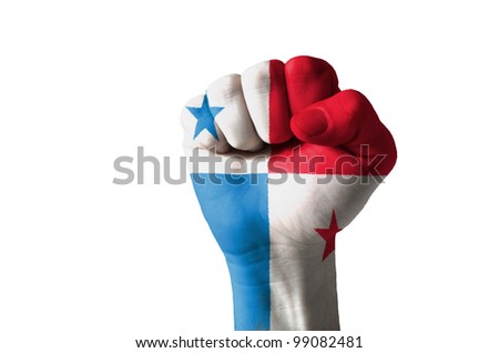 Low key picture of a fist painted in colors of panama flag