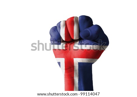 Low key picture of a fist painted in colors of iceland flag