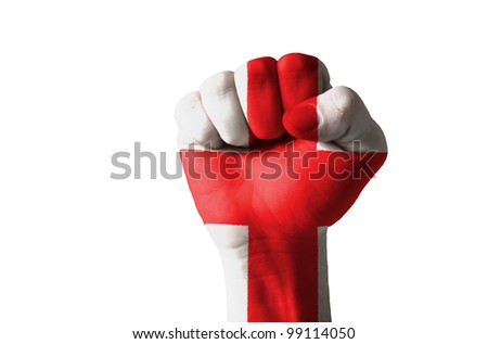 Low key picture of a fist painted in colors of england flag