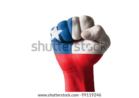 Low key picture of a fist painted in colors of chile flag