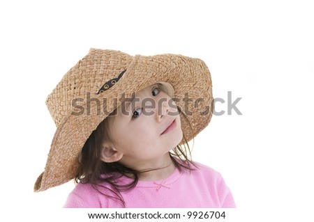 A young asian american girl being silly with a cowboy hat