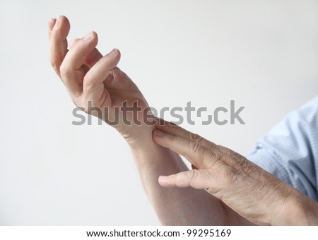 man with pain in his wrist area