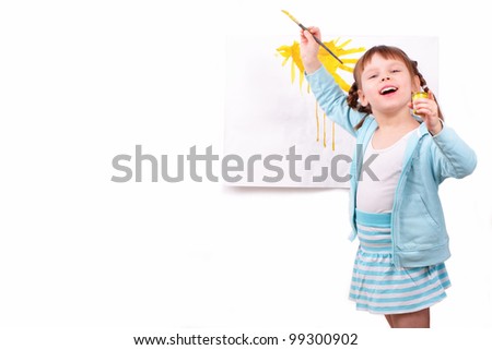 Little girl draws a picture