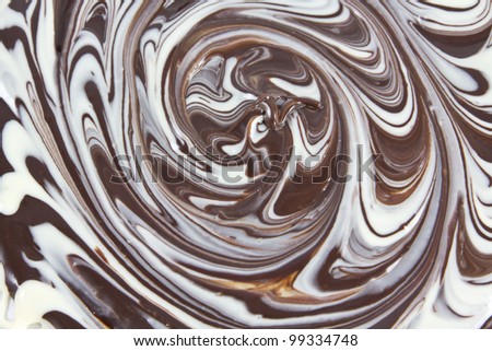 Picture of white and black chocolate mixed together forming a texture