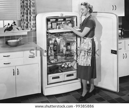 Woman with open refrigerator Royalty-Free Stock Photo #99385886