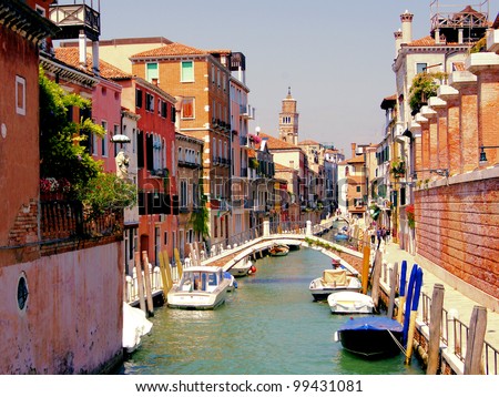 Small quaint canal in the Dorsoduro neighborhood of historic Venice Royalty-Free Stock Photo #99431081