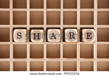 Share word construction with letter blocks / cubes and a shallow depth of field