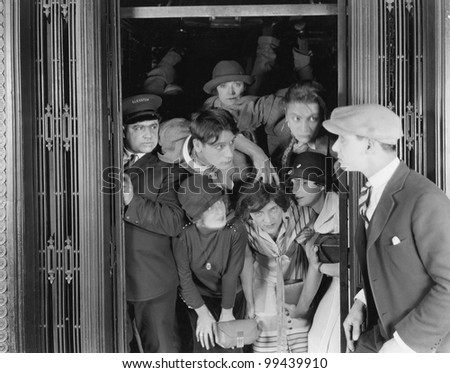 Overcrowded elevator Royalty-Free Stock Photo #99439910