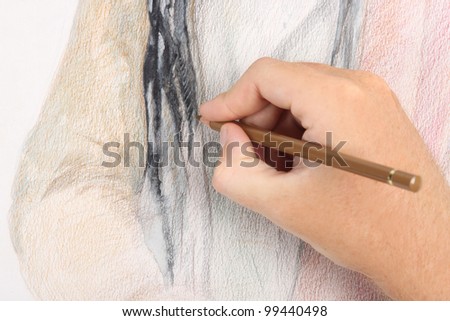close up of man hand drawing pencil picture