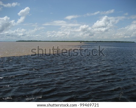 The Meeting of Waters (Portuguese: Encontro das Aguas) is the confluence between the Rio Negro, a river with dark (almost black coloured) water, and the sandy-coloured Amazon River or Rio Solimoes.