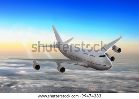 Modern airplane  over the clouds. Royalty-Free Stock Photo #99474383