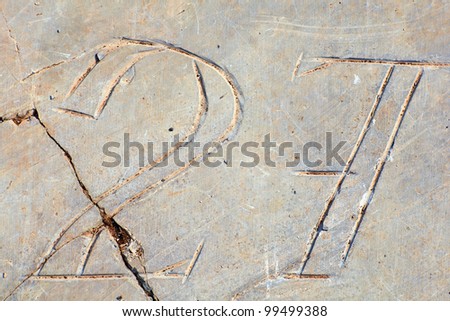 Photo of Numbers etched in stone