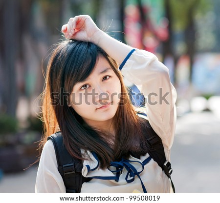 A portrait of a young female student on campus