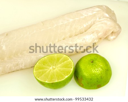 Raw white fish fillet, with lime fruit