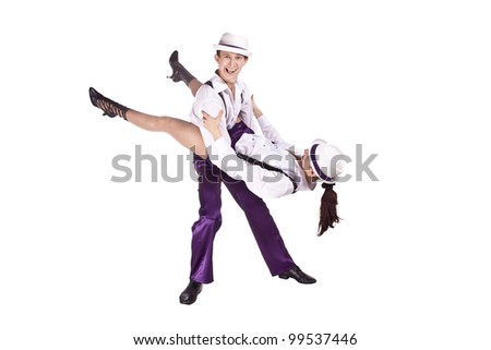 Studio photography on a white background, dancers dressed as rock and roll.