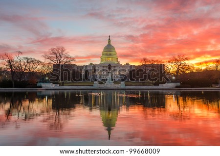 Washington DC, Capitol Building in a cloudy sunrise with mirror reflection Royalty-Free Stock Photo #99668009