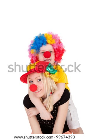 cute little boy and his young beautiful mother dressed as the clowns
