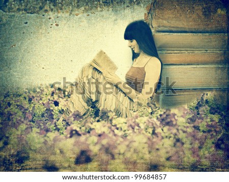 Woman reading book on the meadow. Old image style