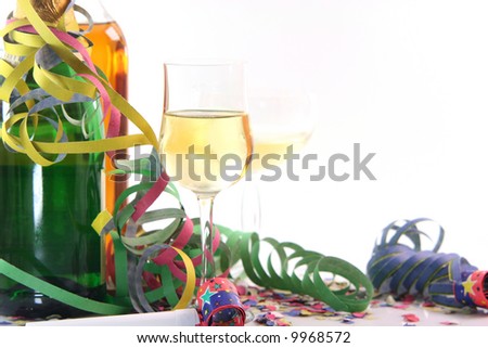 party time with copy space glasses spirits and paper confetti with streamers and party blowers on white background