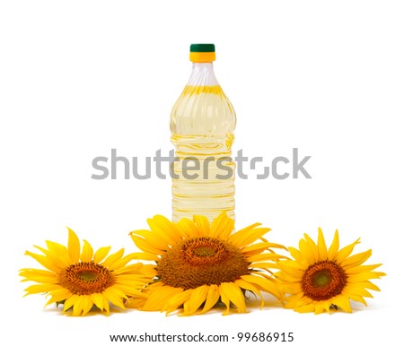 Vegetable oil in a bottle with flowers sunflower isolated on a white background