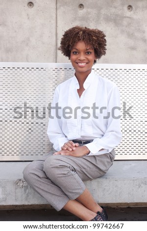 pretty African American executive sitting outside