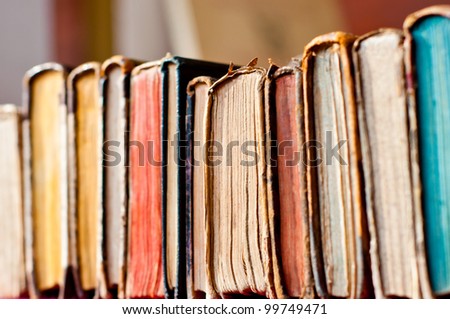 old books row background Royalty-Free Stock Photo #99749471