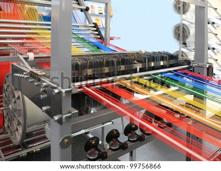 yarn warping machine in a textile weaving factory Royalty-Free Stock Photo #99756866