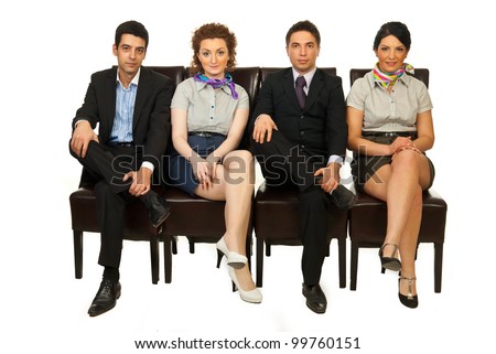 Row of four business people team standing on chairs with legs crossed and waiting isolated on white background