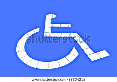 The Reserved car park for handicapped isolated on blue background