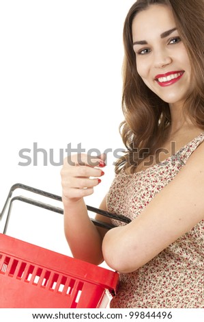 smiling girl with red shopping basket, white background