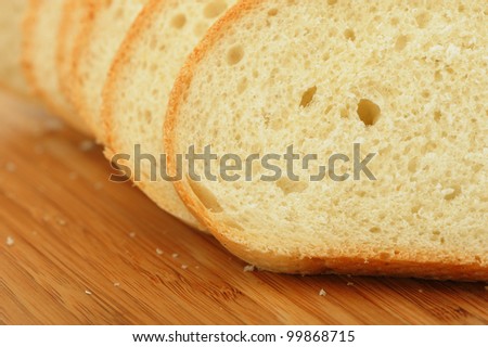 The cut bread on a chopping board. Photo closeup