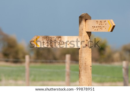 Public footpath sign In countryside with beautiful lighting